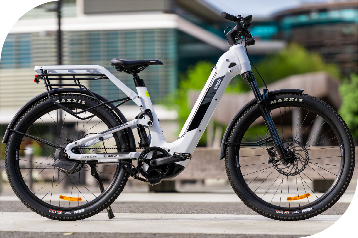 White electric bicycle with black tires on a blurred background