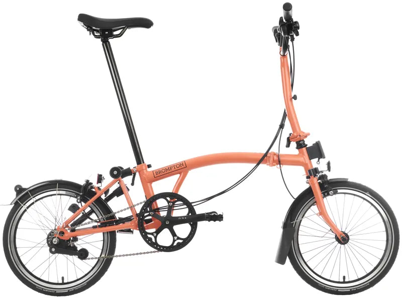 Orange folding bicycle on a white background