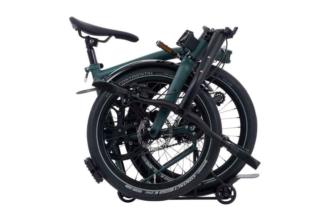 Brompton G Line Folded bicycle on a white background