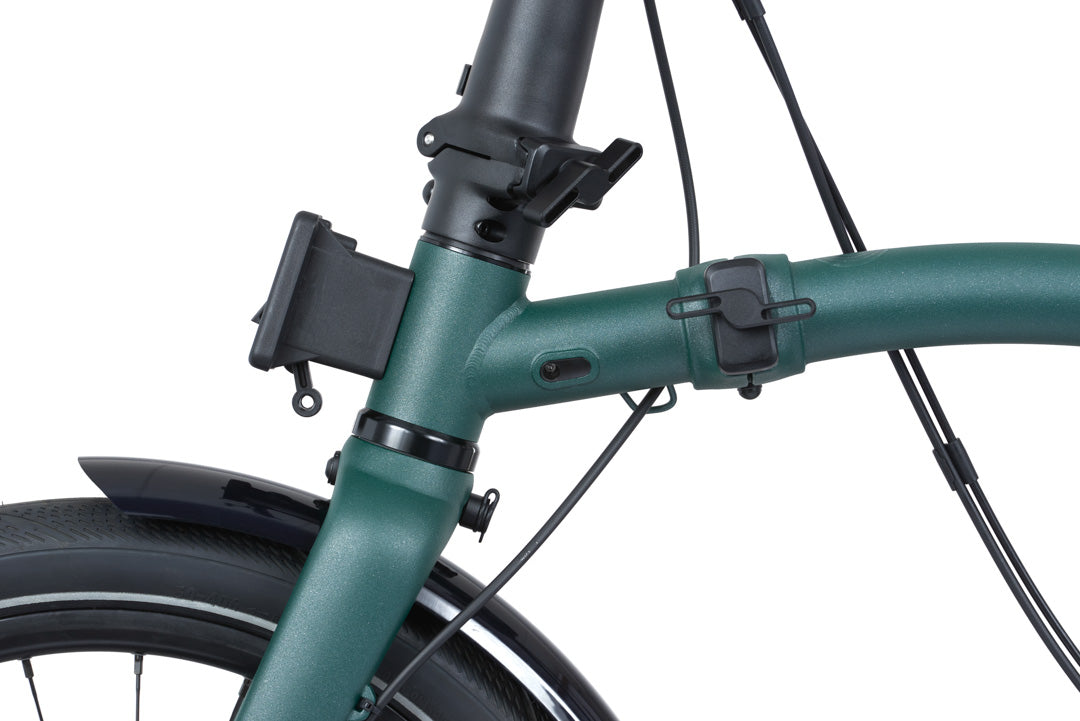 Brompton G Line Green bicycle with a phone mount on a white background