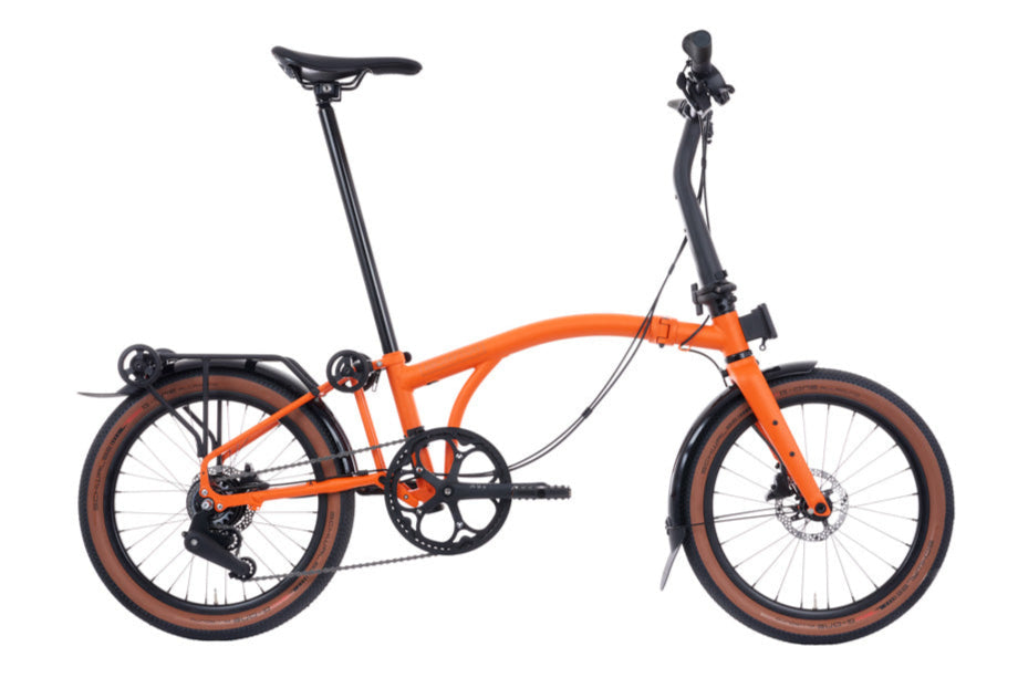 Brompton G Line Orange folding bicycle on a white background