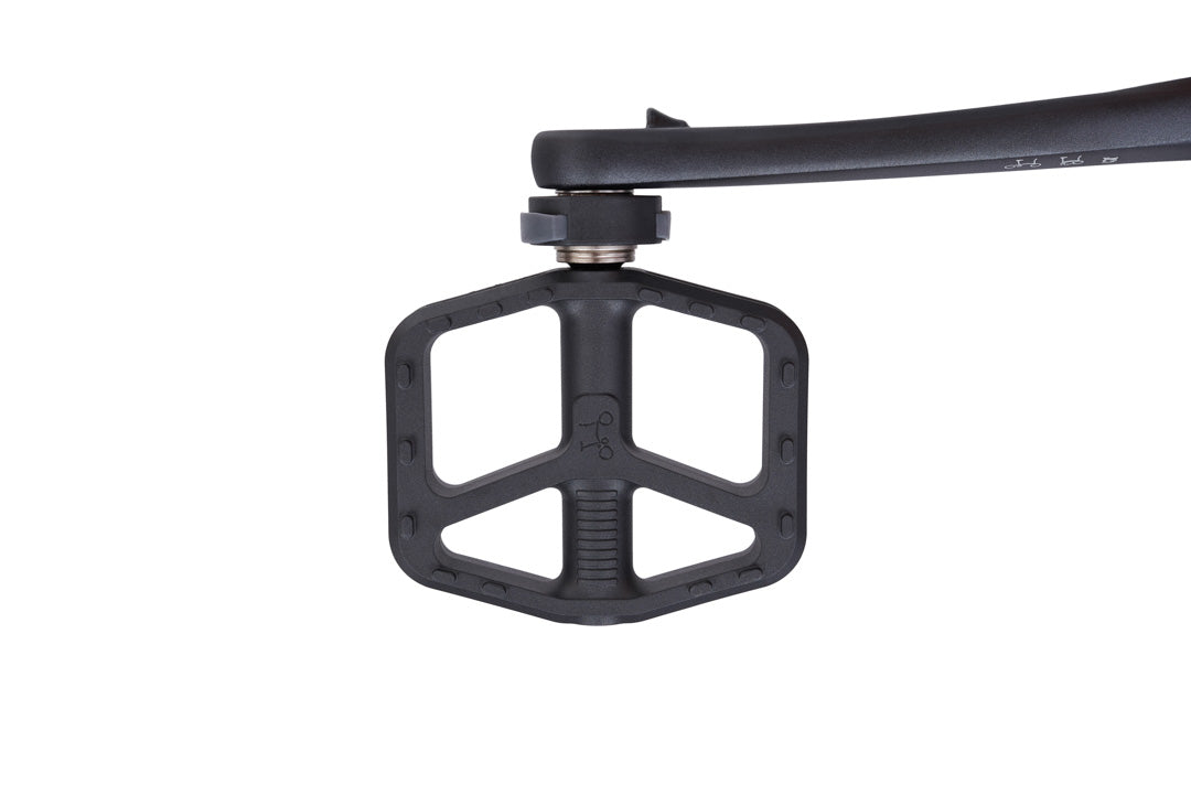 Brompton G Line Close-up of a black bicycle pedal on a white background