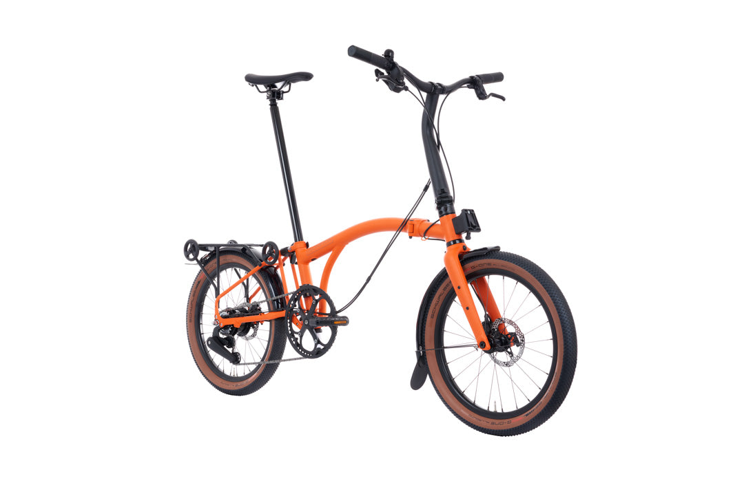 Brompton G Line Orange folding bicycle on a white background