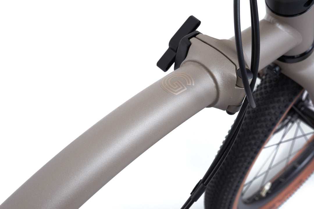 Brompton G Line. Close-up of a bicycle frame with a white background