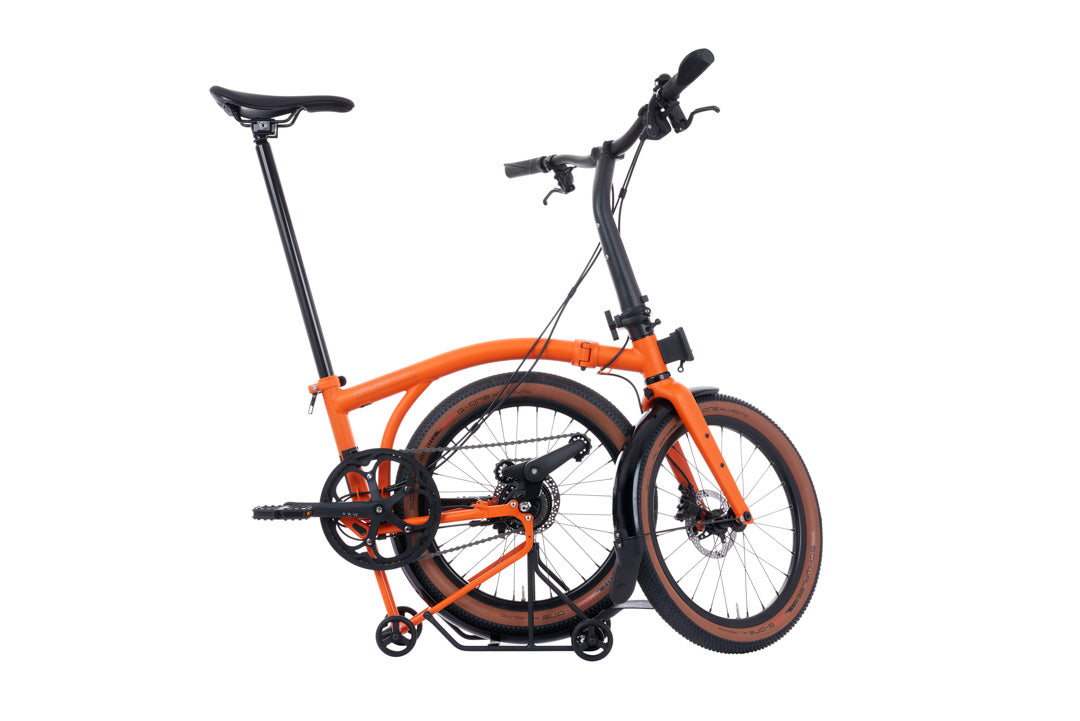 Brompton G Line Orange and black folding bicycle on a white background