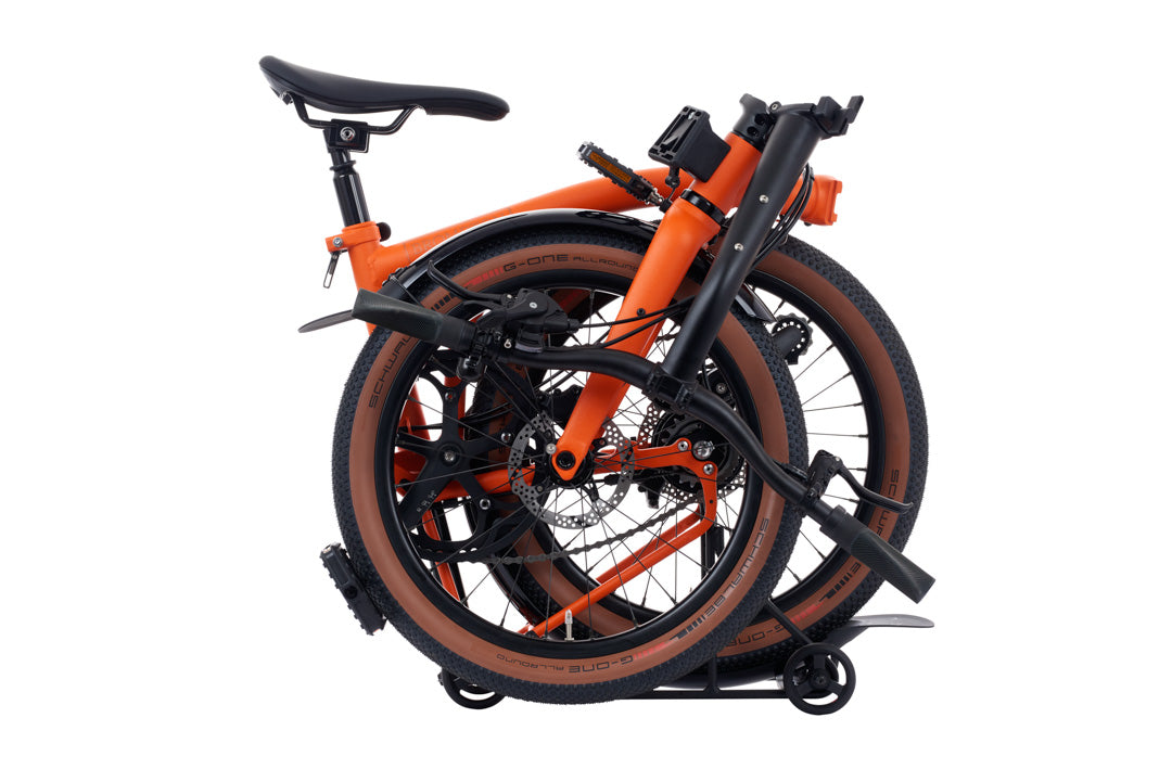 Brompton G Line Orange folding bicycle on a white background