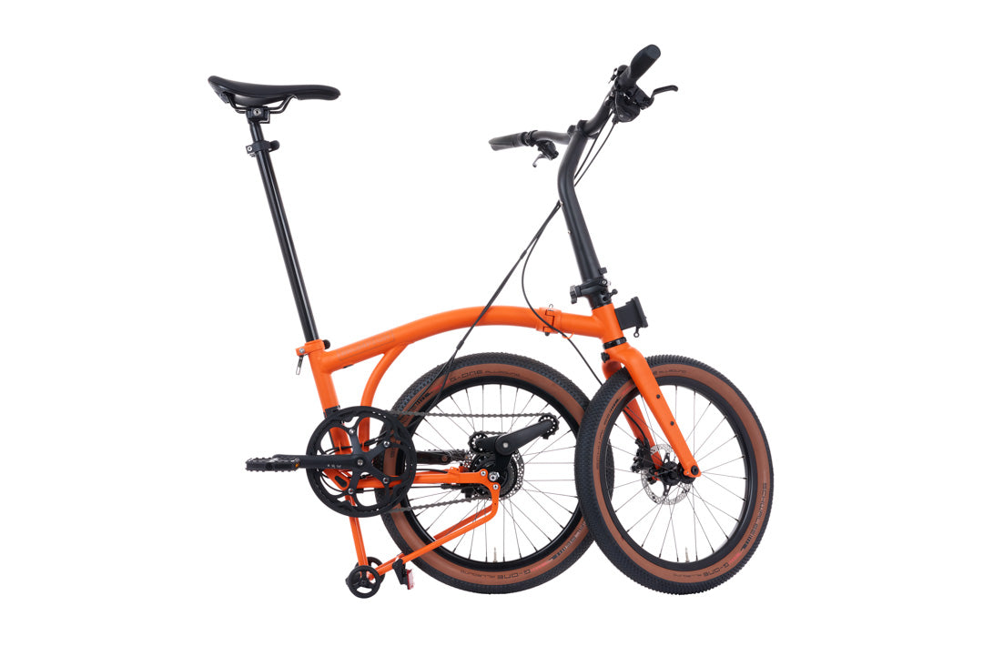 Brompton G Line Orange bicycle on a white background