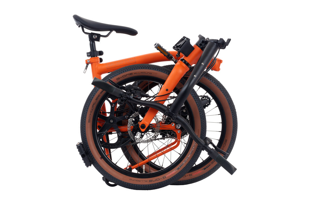 Brompton G Line Orange folding bicycle on a white background