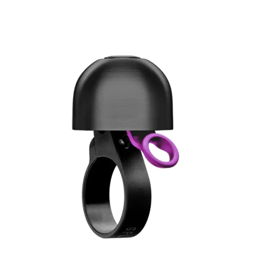 Black bike bell with purple jingle on a white background